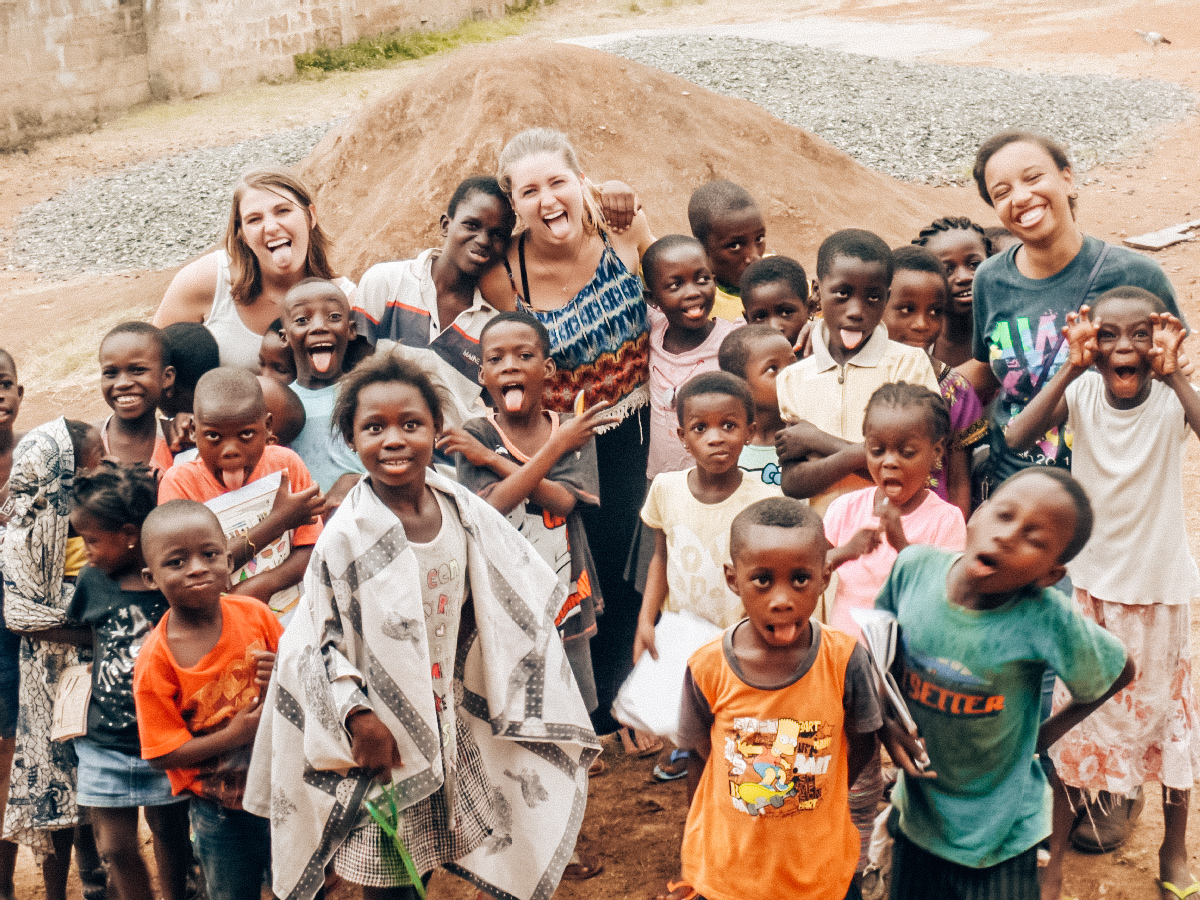volunteers with children in Africa