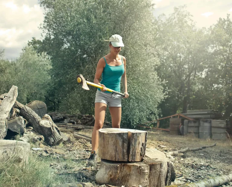 tree pruning woman with axe